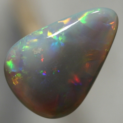 SOLID SEMI BLACK OPAL Bright rolling flashes, orange, green and purple